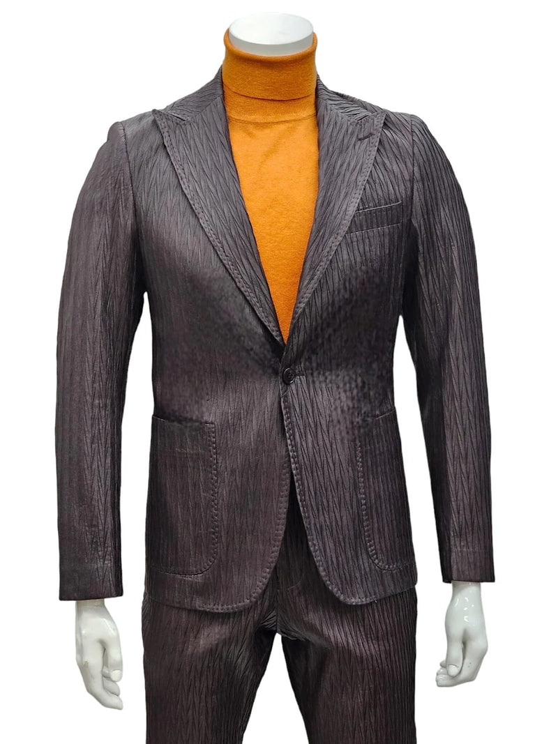 Men's brown slim-fit suit with peak lapels, one-button closure, and textured fabric (diagonal pattern). Includes two front pockets and a notch.

