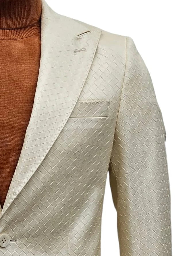 Men's slim-fit suit. Ivory, textured fabric with basket weave. One-button design, peak lapel. Features a chest pocket. Pattern & color emphasize structure.
