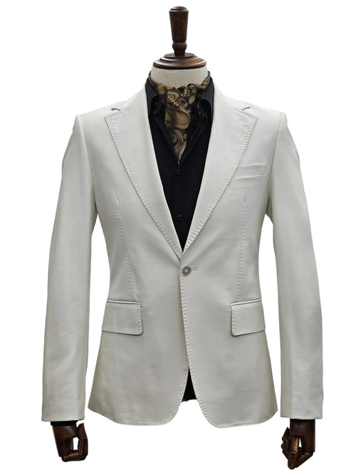 Men's bone-colored, slim-fit leather suit with 1 button closure. Tailored shape, notch lapels, and two front pockets. Visible stitching details. Displayed on a mannequin.