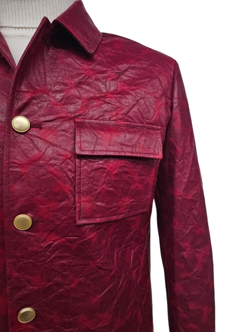 Burgundy faux leather suit. Slim fit, two-piece. Wrinkled texture. Collared jacket with single chest pocket and gold-tone buttons. Casual style.
