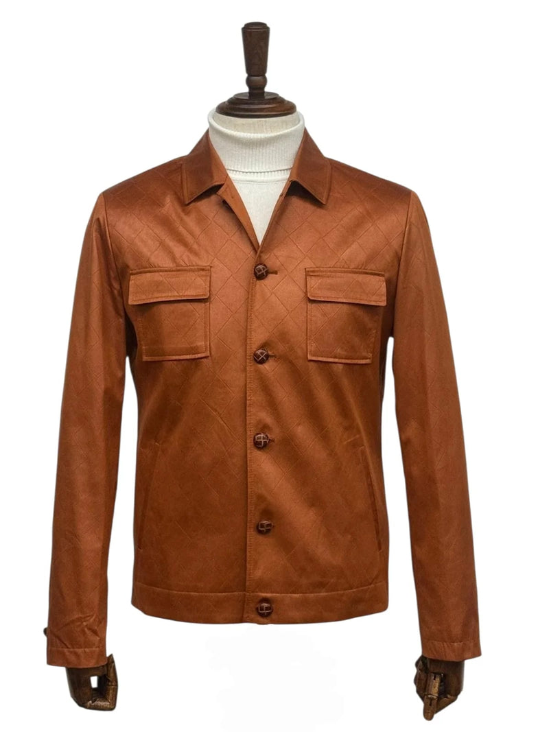 Men's brown faux leather slim-fit suit with quilted texture. Pointed collar, two chest pockets, and button closure with contrasting buttons.
