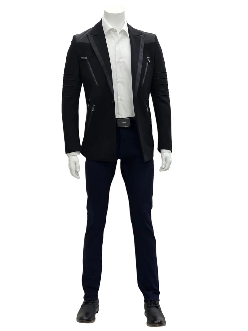 Men's black slim fit suit with a notch lapel, single-button closure, and long sleeves. Includes two zippered pockets & satin lapels. Paired with a white shirt, navy pants, and black shoes.
