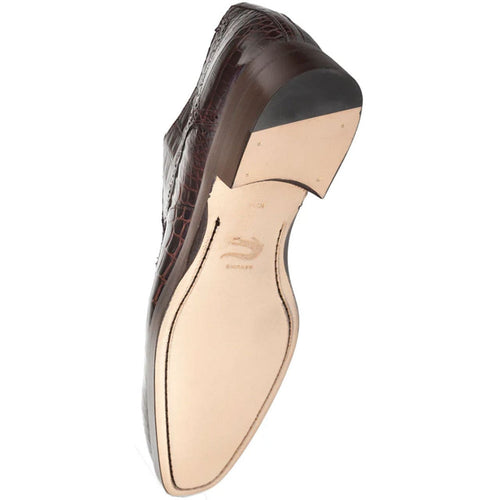 Brown alligator derby shoes. Pointed toe, dark brown textured leather upper. Light-colored sole with a small heel. Lace-up closure for secure fit.
