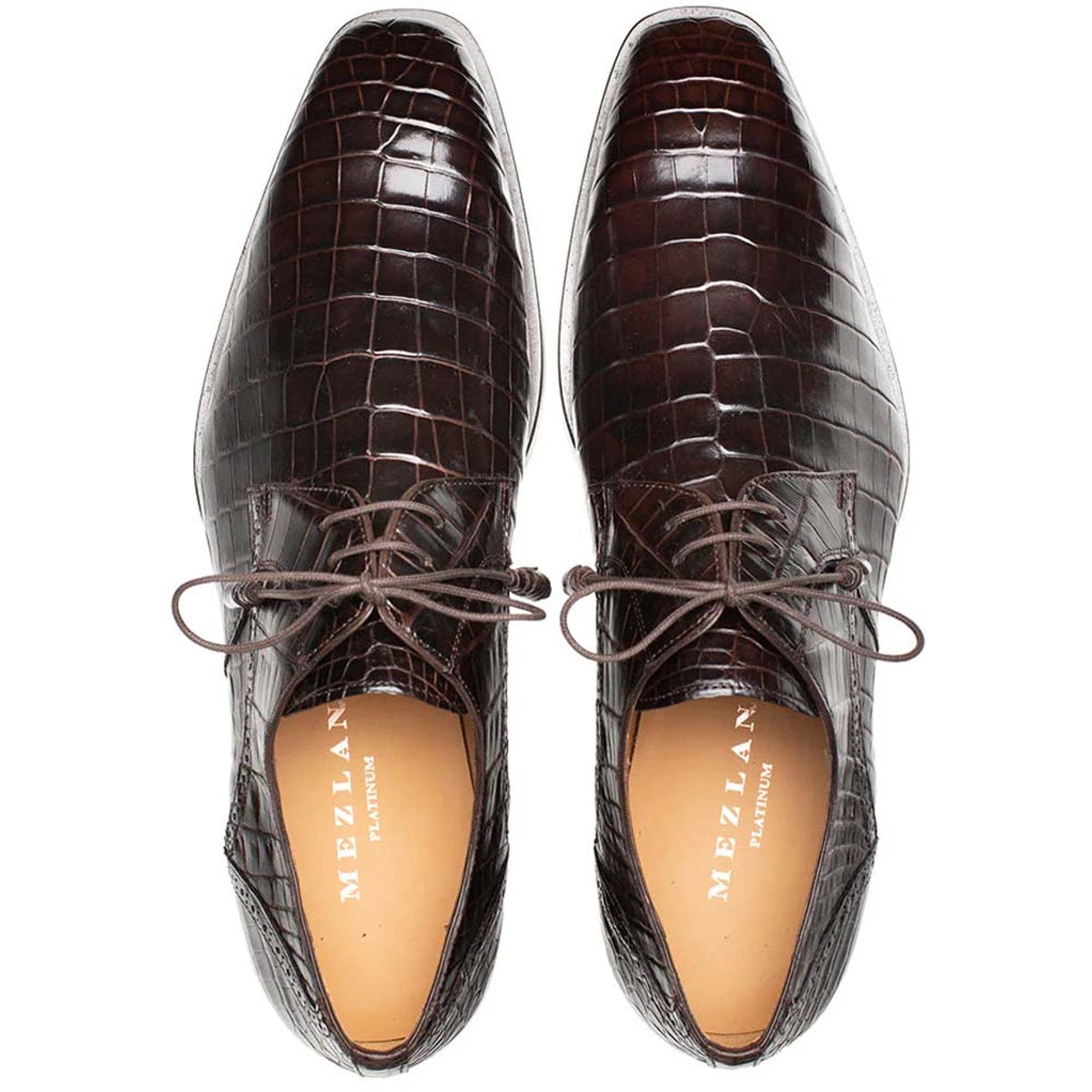 Mezlan men's brown alligator derby shoes. Glossy, pointed-toe, lace-up design with a distinct alligator skin pattern. Leather soles and light-colored insoles with the brand name.

