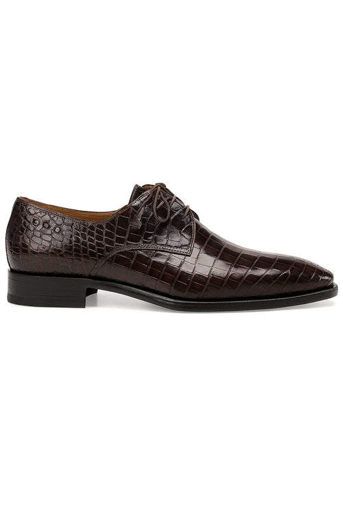Men's brown alligator derby shoes. Pointed toe, black heel. Dark brown, large scale texture on upper. Central laces on vamp, open throat. Smooth brown leather interior.
