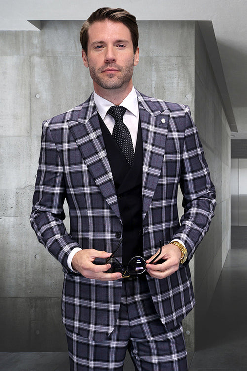 Men's grey windowpane plaid suit. One-button closure, wide peak lapel, and vest included. Crafted from a wool blend fabric.
