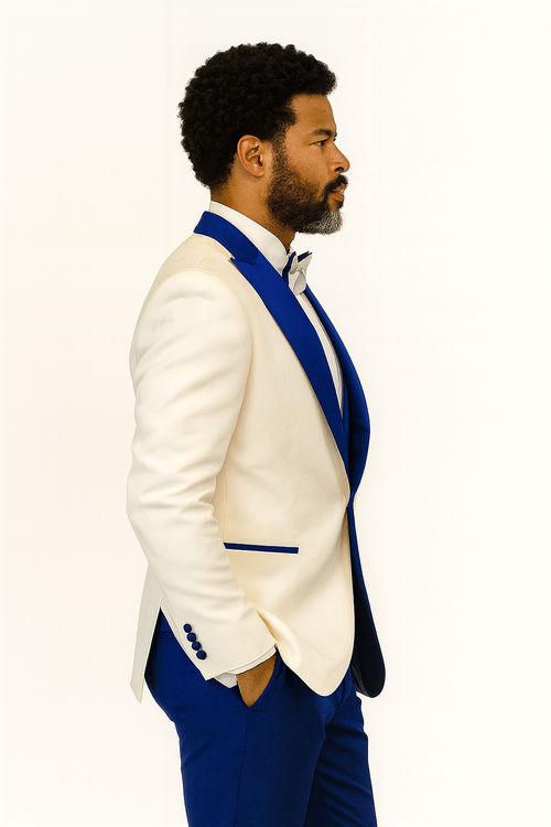 White paisley tuxedo jacket with royal blue shawl lapels & matching trousers. Features a paisley pattern & bow tie. Classic & stylish.
