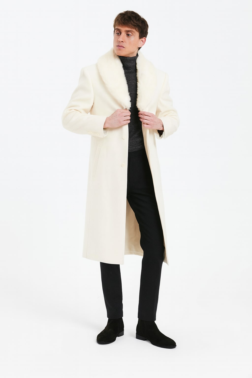 Ivory men's full-length overcoat with faux fur shawl collar. Off-white color, straight silhouette, button closure. Luxurious and stylish.

