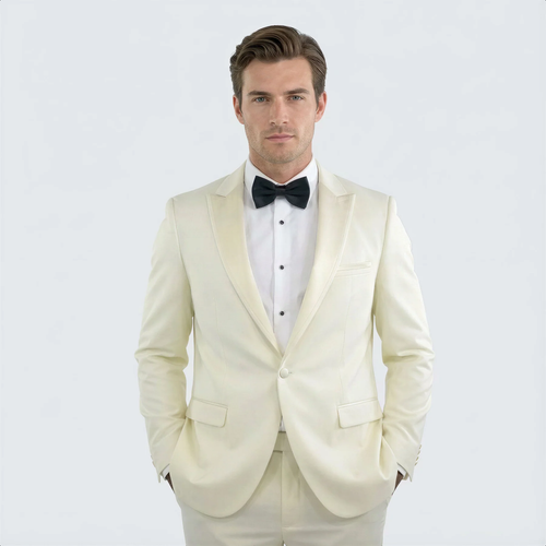 Ivory peak lapel slim fit tuxedo: fitted, single-breasted, smooth fabric. Satin lapel, two front pockets. Includes white shirt and black bow tie.
