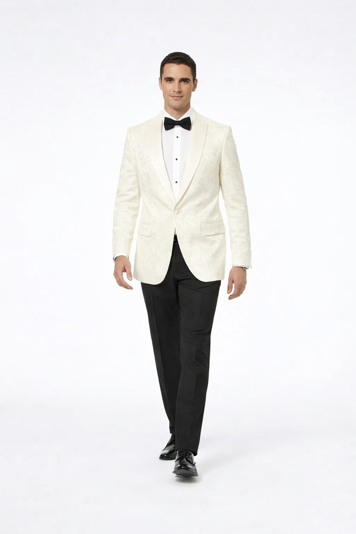 Men's ivory paisley tuxedo jacket. Fitted, single-breasted, peaked lapels. Textured fabric with intricate paisley pattern. Two front pockets.
