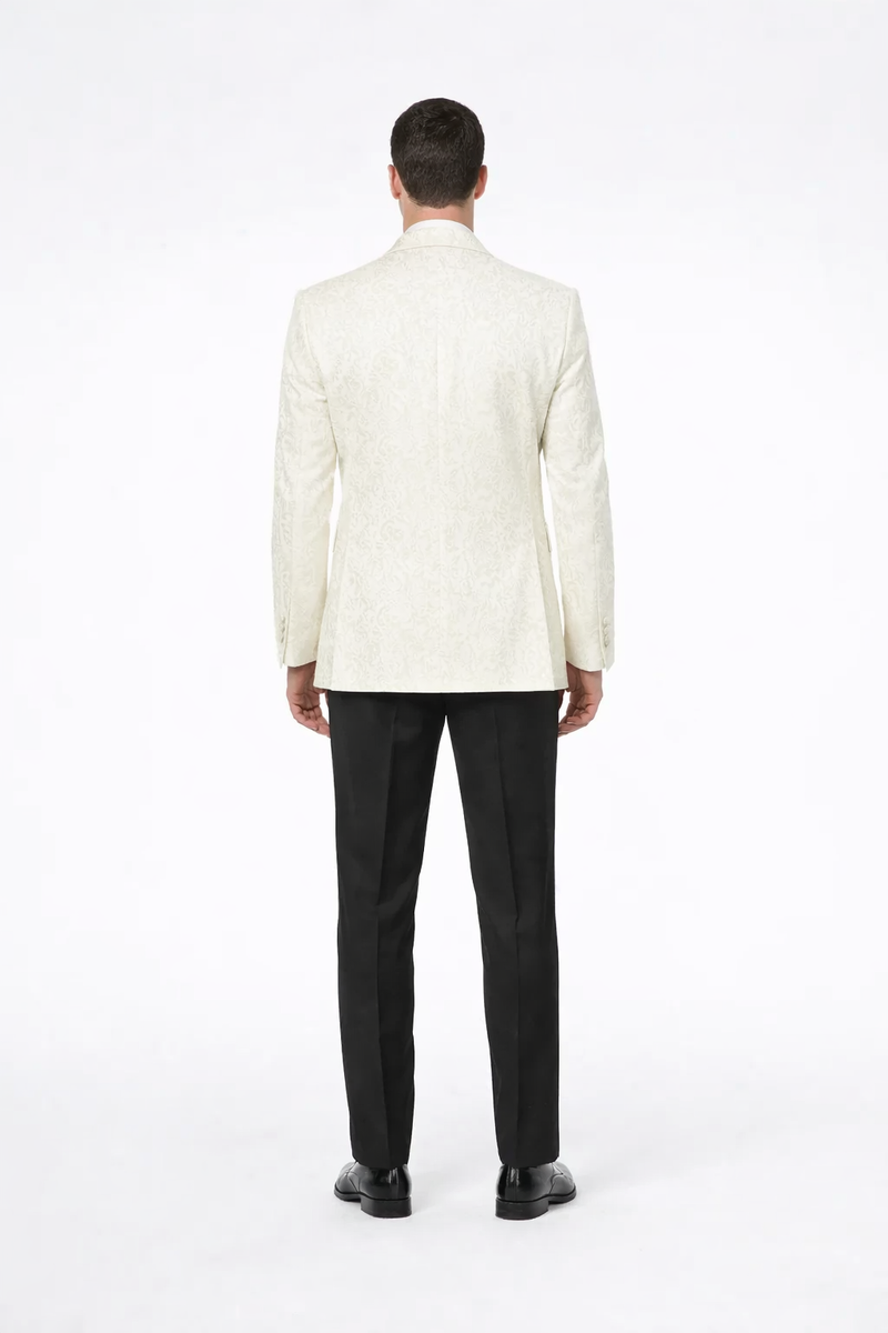 Alberto Nardoni men's ivory paisley tuxedo jacket. Fitted, textured ivory fabric with intricate paisley pattern. Structured lapels, long sleeves, and a tailored back for a clean, refined silhouette.

