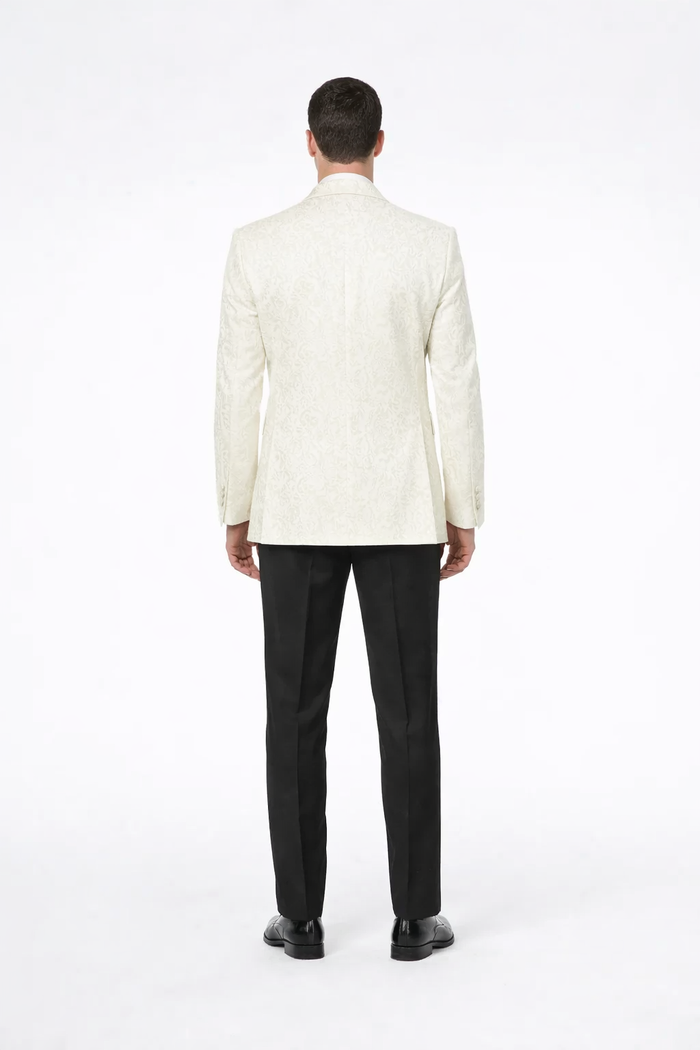Alberto Nardoni men's ivory paisley tuxedo jacket. Fitted, textured ivory fabric with intricate paisley pattern. Structured lapels, long sleeves, and a tailored back for a clean, refined silhouette.
