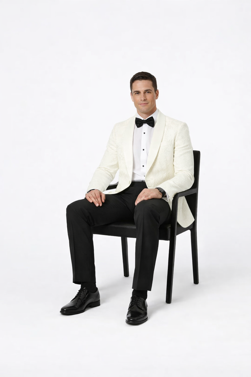 Alberto Nardoni men's ivory paisley tuxedo jacket. Structured fit, single-button closure, peaked lapels. Textured ivory fabric with subtle paisley pattern. Long sleeves, side pockets.
