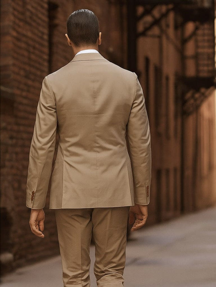 Men's khaki cotton suit: Tailored jacket (single vent) & tapered trousers. Buttoned cuffs. Uniform light khaki color. Classic and versatile.
