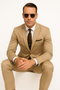 Khaki cotton suit with a tailored fit. Tan color, single-button jacket with notch lapel, chest pocket, and side pockets. Slim-fitting trousers. Smooth, slightly sheened material.
