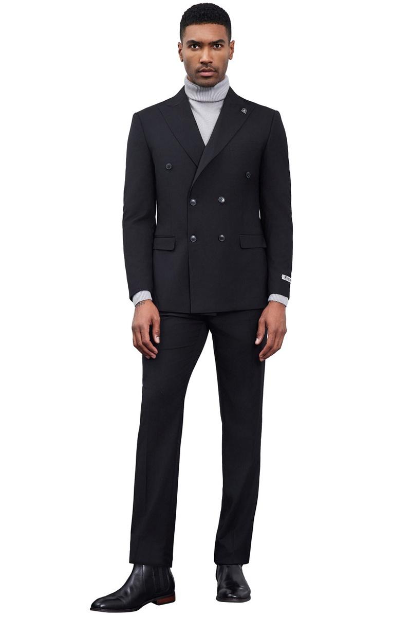 Stacy Adams men's black double-breasted suit. Tailored jacket, straight-cut trousers, slim fit. Smooth, likely wool blend fabric with subtle sheen. Paired with gray turtleneck, black ankle boots, maintaining a dark aesthetic.
