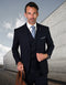Men's slim-fit wool suit with a double-breasted navy vest. Jacket: single-breasted, structured shoulders. Vest: buttoned. Fabric: smooth wool. Sleek, tailored design.
