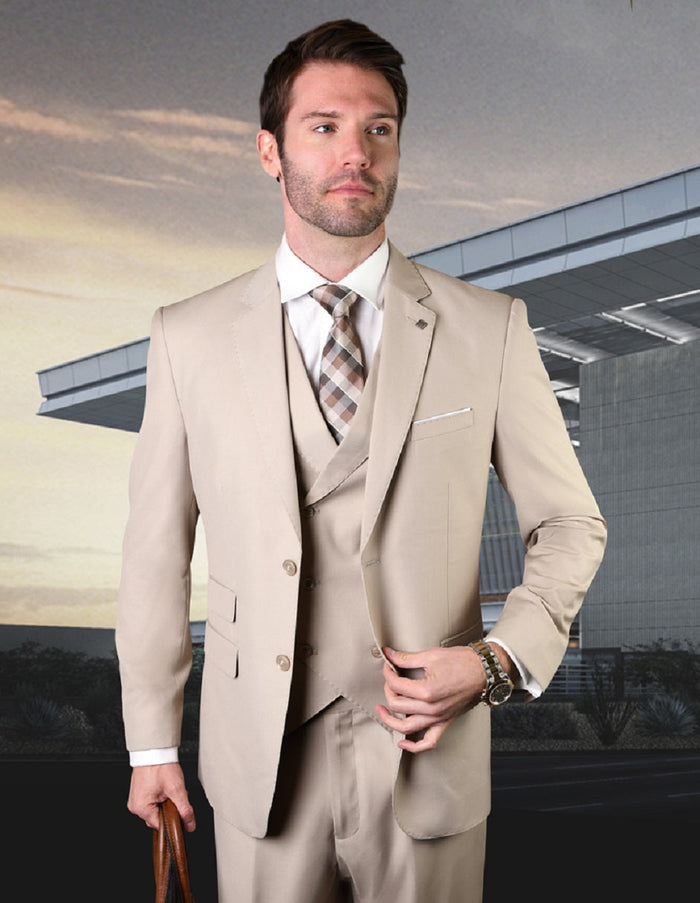 Tan wool slim-fit men's suit with a double-breasted vest. Features a tailored fit, structured shoulders, and notched lapels. Single-breasted jacket and matching vest. Smooth, patternless fabric emphasizes sharp lines and a formal silhouette.
