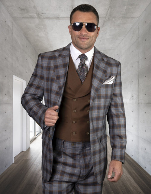 Men's wool suit: 2-button, peak lapel, copper plaid with blue/brown tones. Includes a matching double-breasted brown vest. Structured silhouette, sharp lapels, fitted waist. Plaid pants complete the look.