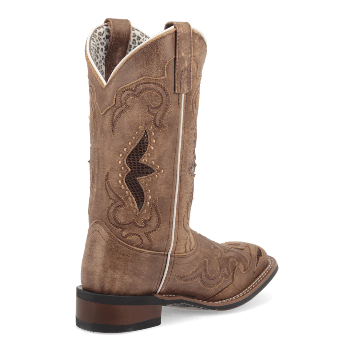 Laredo Spellbound women's boot: tall, brown suede-like shaft, pointed toe, structured design. Intricate stitching & cutouts. White piping detail. Low stacked heel. Patterned interior lining. Classic silhouette.

