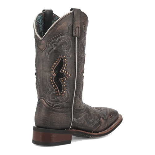 Laredo women's western boot in distressed dark gray leather. Features include a tall shaft, pointed toe, intricate stitching, metal studs, and a pull tab. Dark wood heel for stability.
