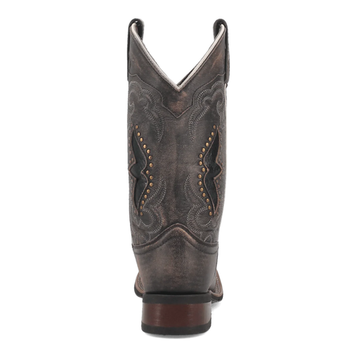 Laredo women's western boot: Tall, distressed brown leather with pointed top, decorative stitching, and brass studs. Features a wooden-look heel and contrasting black stitching.
