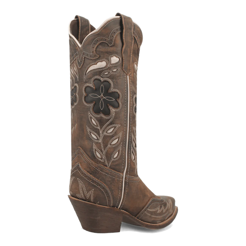 Laredo Zuri women's boot: tall, muted brown leather with black floral designs. Rounded toe, stacked heel, scalloped upper edge, pull tabs. White stitching detail.
