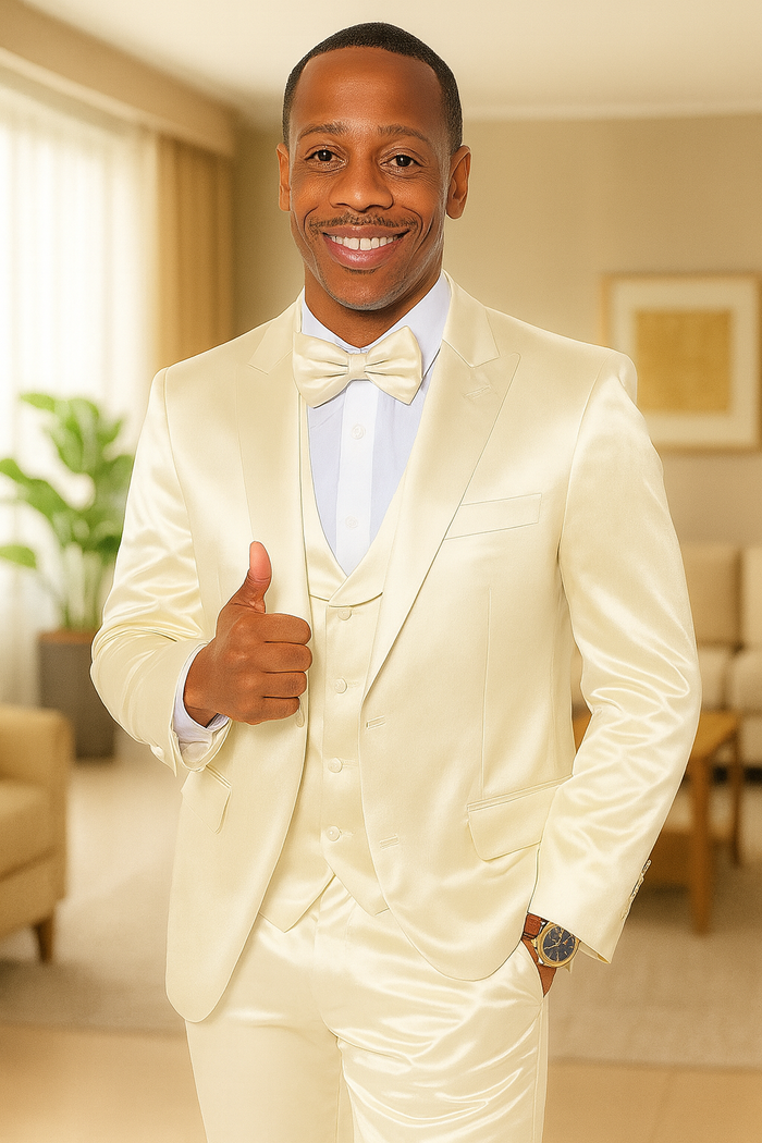 Champagne satin tuxedo set for men. Includes jacket (single-button, sleek lapel), matching trousers, and bow tie. Features a light blue dress shirt underneath, offering a contrast.
