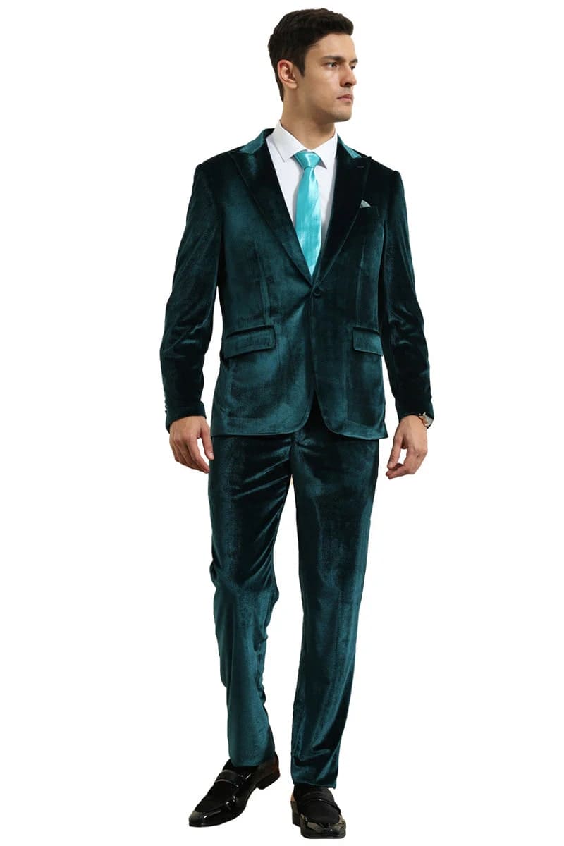 Slim fit teal green velvet men's suit. One-button jacket with notch lapels, two pockets, and matching trousers. Soft, shiny fabric.

