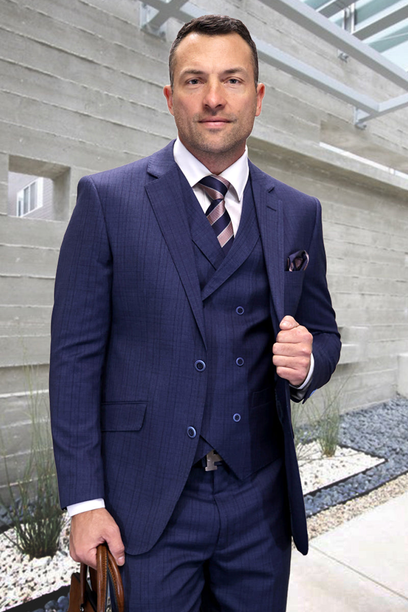 Men's modern fit blue plaid wool suit. Includes a double-breasted vest and a striped tie. Fitted design with structured shoulders and defined lapels. Primarily blue with lighter/darker shades in the plaid pattern.
