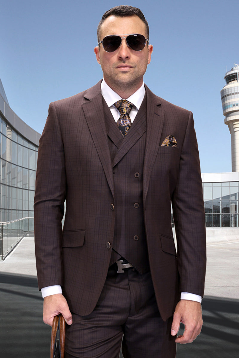 Brown plaid men's modern fit wool suit with double-breasted vest. Includes white shirt, patterned tie. Narrow lapels, two pockets. Fitted silhouette, visible jacket and vest buttons.
