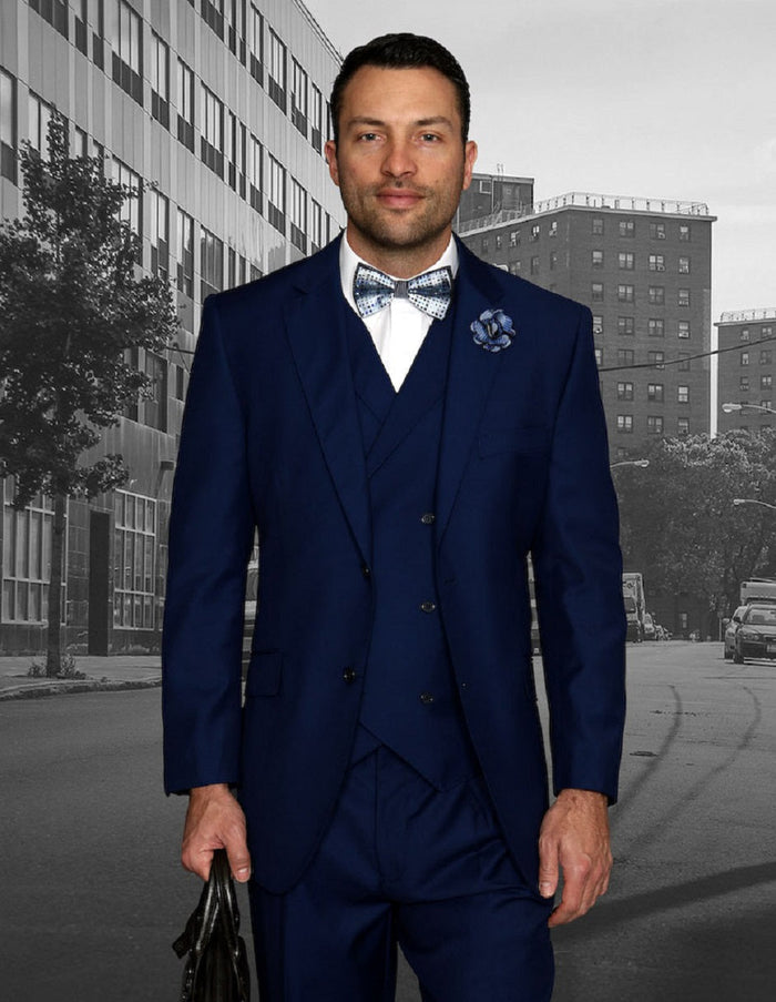 Sapphire blue men's suit: Classic fit, 2-button jacket, notch lapel. Pleated trousers and double-breasted vest create a layered look. Smooth fabric, fully lined jacket, straight-leg trousers.