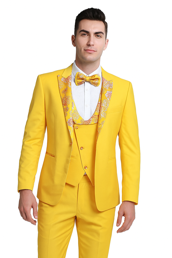 Golden bloom men's three-piece suit in vibrant yellow with floral accents. Includes a fitted jacket (peak lapel, single-button), vest (deep V-neck), and trousers. Smooth fabric, tailored for a structured, fashionable look.
