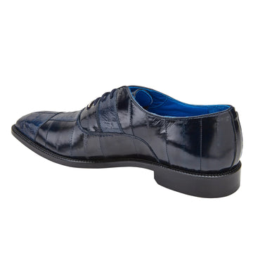 Navy blue men's Belvedere dress shoe. Ostrich leg pattern eel skin upper with a sleek, pointed shape. Glossy finish with contrasting blue interior. Black sole provides support.
