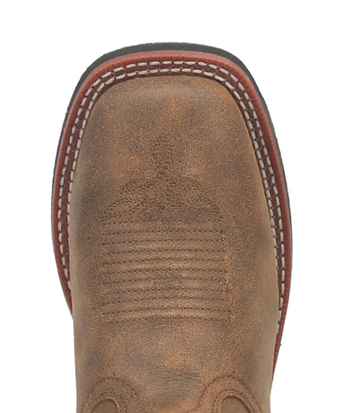 Laredo Megan women's boot. Brown textured material, rounded-square toe, tan edge stitching, and red-tinted outsole. Features vertical ribbed toe panel for structure.
