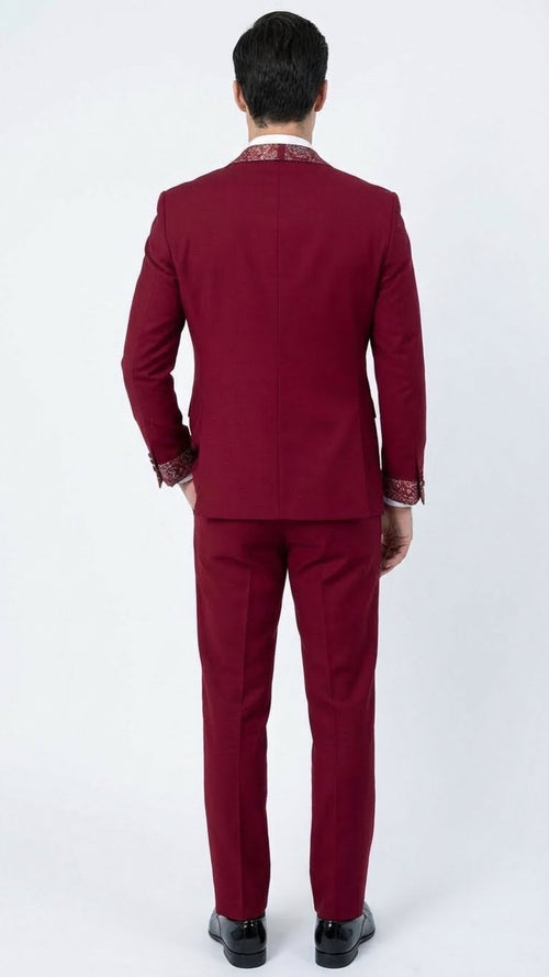 Alberto Nardoni men's tuxedo suit: burgundy jacket and pants. Fitted design with white embellished collar and cuffs. Stylish and distinctive formal wear.
