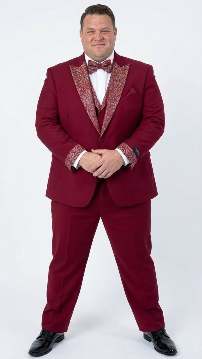 Burgundy men's tuxedo with white accents. Features a V-lapel jacket and matching trousers. Bow tie & pocket square echo embellishments. Structured, tailored formal fit.
