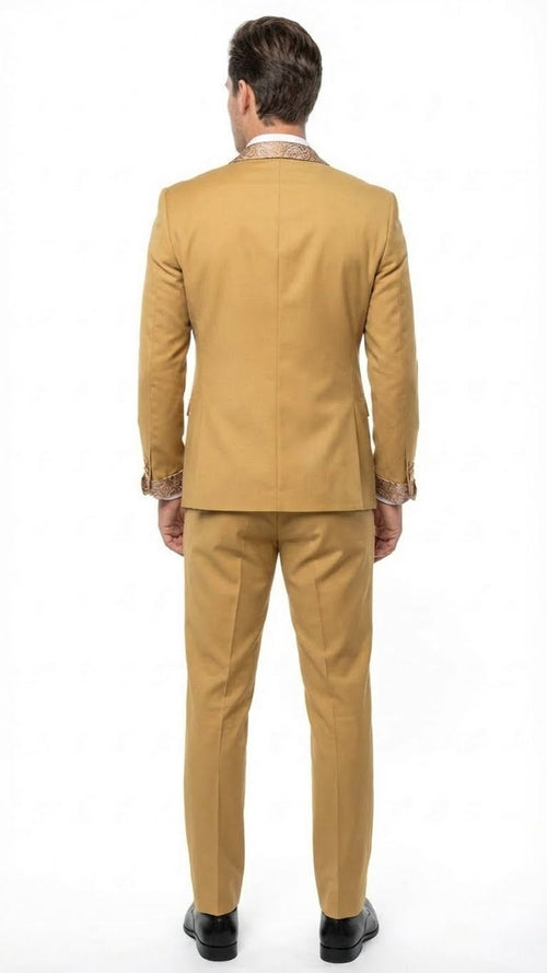 Alberto Nardoni men's light gold tuxedo suit. Single-breasted jacket with embellished collar & cuffs, paired with straight-leg trousers. Tailored, close-fitting silhouette for a modern look, smooth texture.
