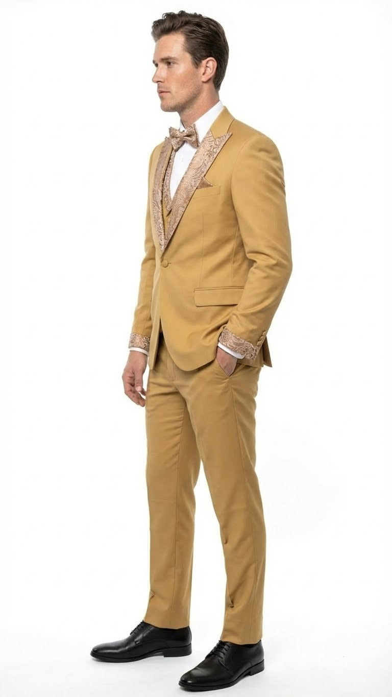 Alberto Nardoni men's gold tuxedo: fitted, single-button blazer, straight trousers. Light gold with ornate embellishments. Includes white shirt. Black leather shoes complete the look.
