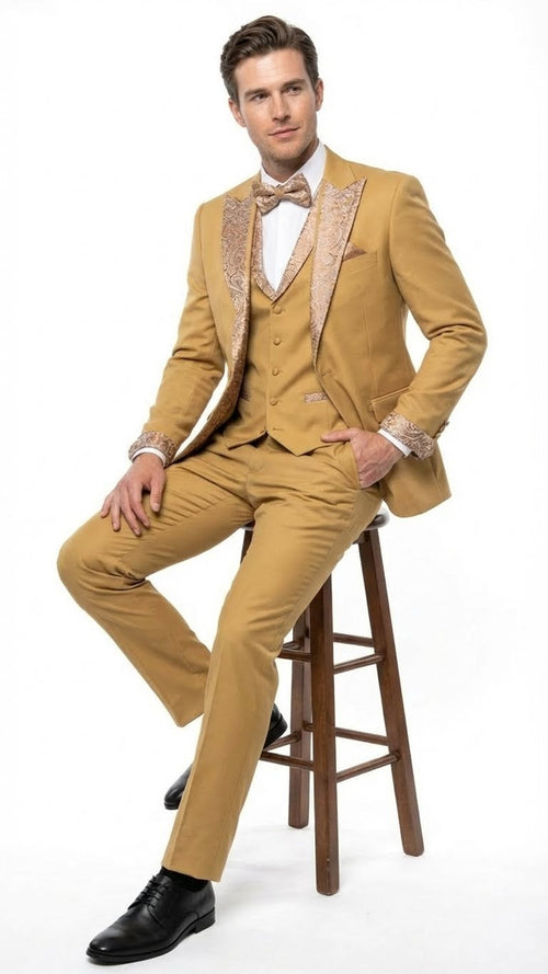 Alberto Nardoni's gold tuxedo suit: tailored fit, gold embellishments on jacket (lapels, cuffs), matching vest and trousers. Includes white shirt, bow tie for contrast. Formal, cohesive.
