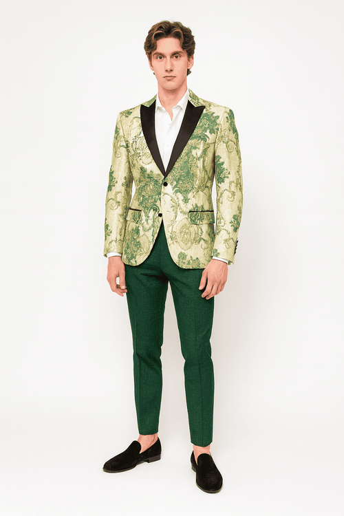 Ivory tuxedo jacket with green floral embroidery, black satin lapel. Paired with hunter green pants. Fitted shape, detailed floral design.
