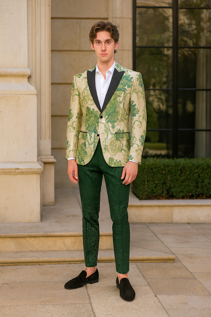 Ivory & green floral embroidered tuxedo jacket with black satin lapel. Paired with hunter green pants. Structured design, intricate patterns.
