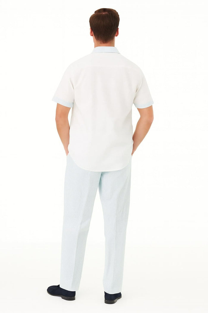 Sky blue men's two-piece set: solid short-sleeve shirt with a collar, paired with vertically striped light blue & white pants. Casual, lightweight look.
