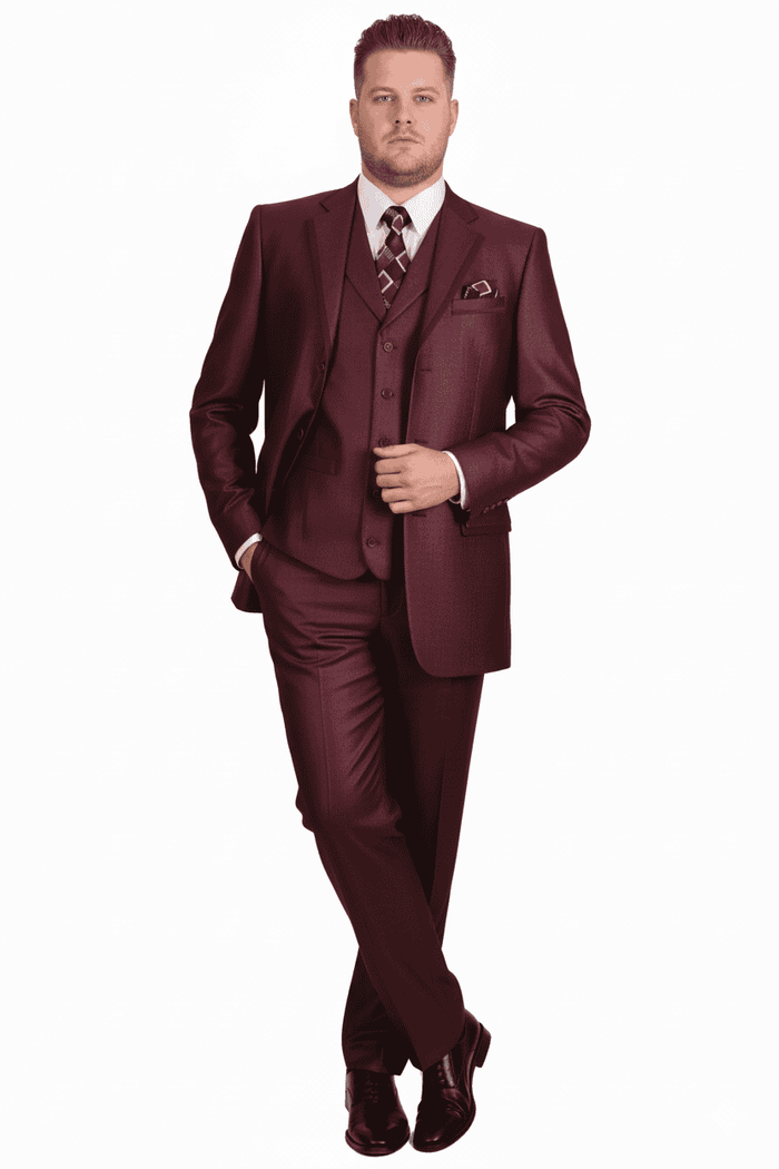 Burgundy three-piece men's suit: classic fit, athletic cut. Features a 3-button blazer, pleated pants, and matching vest. Accessorized with a patterned tie and pocket square for a formal look.