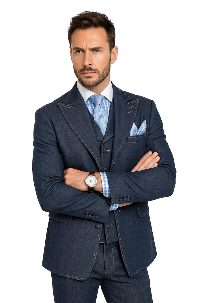 Vintage men's denim suit: fitted blazer with notched lapel and contrasting stitching, matching vest, and tailored pants in deep blue cotton.
