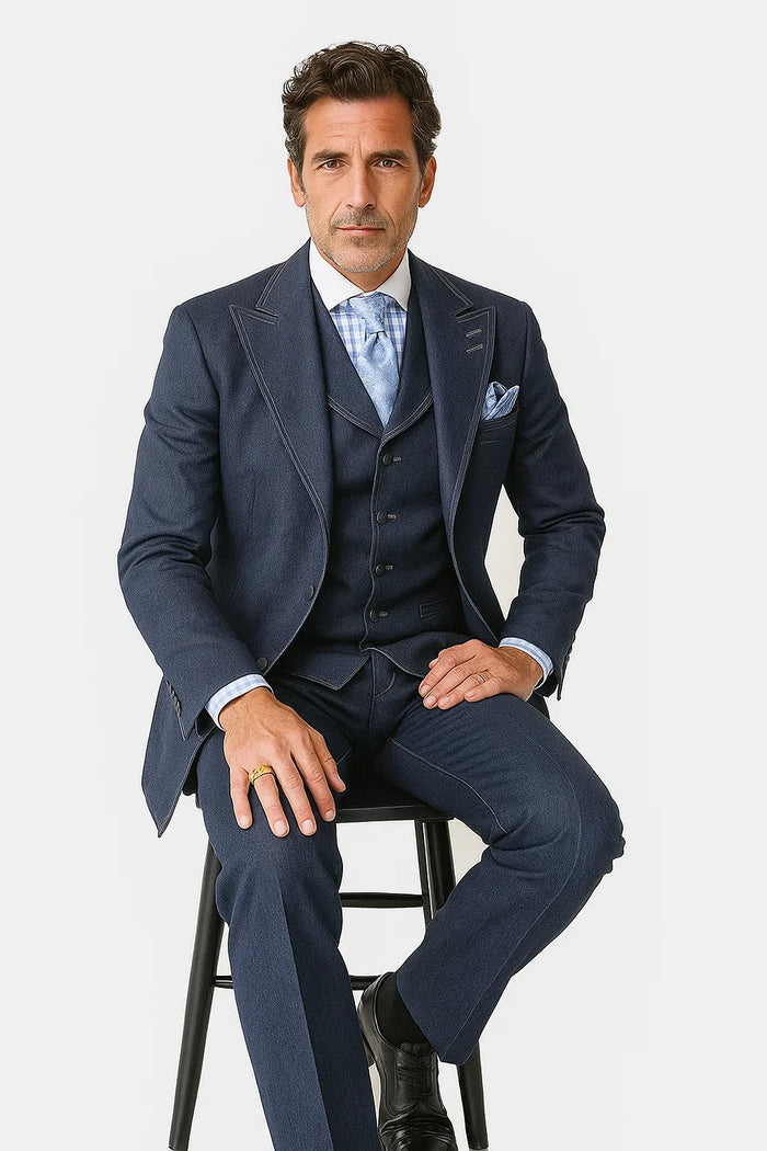 Vintage men's denim suit: fitted blue blazer with notched lapel, matching vest, and pants. All cotton. Features visible stitching for a classic, timeless look.
