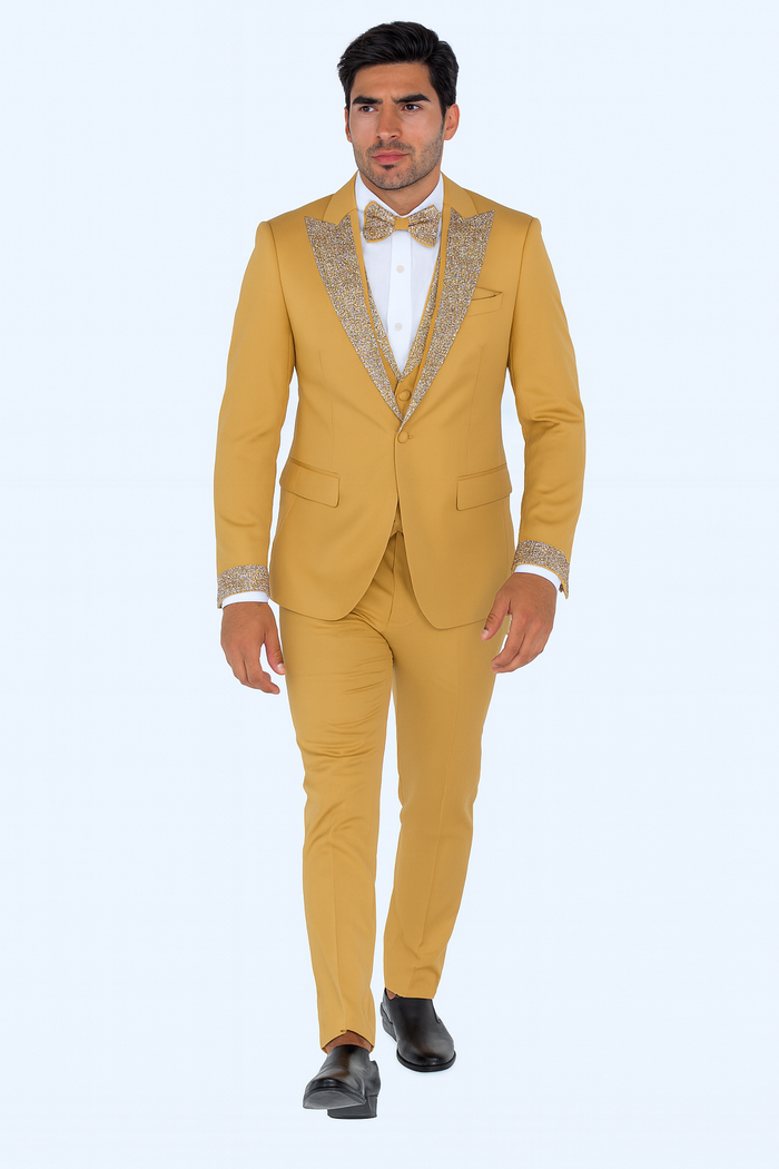 Champagne gold prom tuxedo: fitted, single-breasted jacket with embellished lapels. Matching trousers, vest, and bow tie. Smooth outer fabric with sparkling embellishments. Modern, tailored silhouette.

