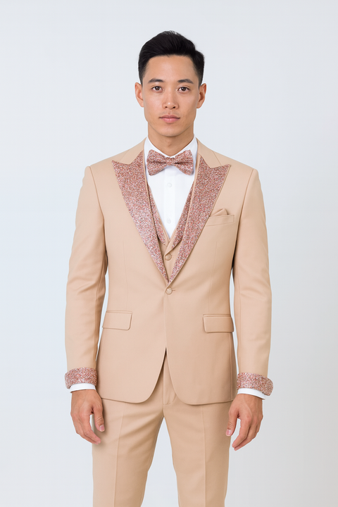 Men's rose gold prom tuxedo: Beige fitted jacket with sequined rose gold shawl lapel and cuffs. Includes white shirt, rose gold bow tie. Features a three-button closure and breast pocket.
