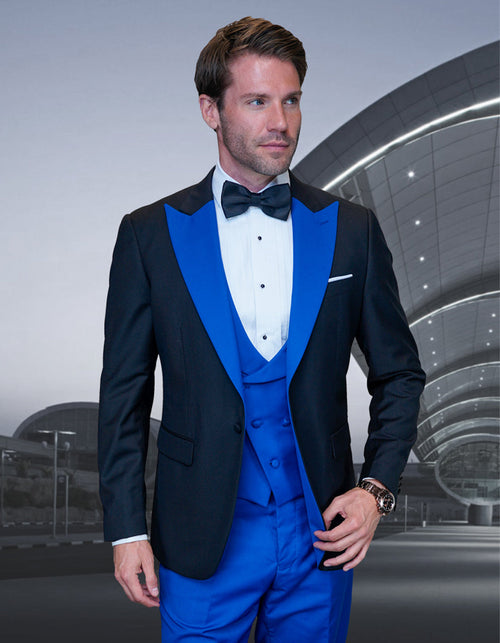 Men's wool tuxedo: Black jacket with wide royal blue peak lapels, matching vest, black trousers. Vest: 3 buttons, deep V-neck. Jacket: Single-button closure, breast pocket. Sharp black/royal blue contrast.