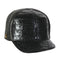 Black hornback leather cap. Structured with a curved brim. Textured, glossy surface. Crocodile skin pattern.
